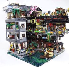 a large lego house with lots of furniture and decorations on the top floor is shown in front of a white background