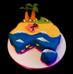 a birthday cake decorated to look like an island with flip flops and palm trees