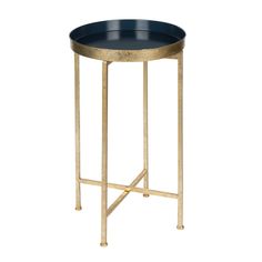 a black and gold metal side table with a round tray on it's legs