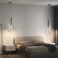 a bed sitting in a bedroom next to two lamps on the side of a wall