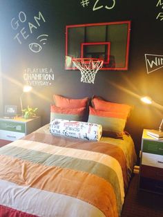 a basketball themed bedroom with chalk writing on the wall