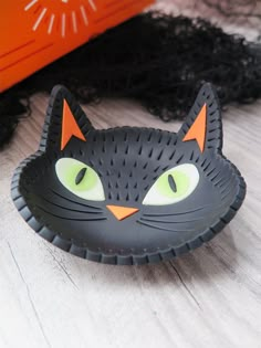 a close up of a cat shaped object on a table