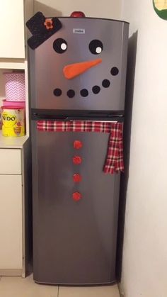 the refrigerator is decorated like a snowman