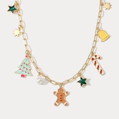 a gold chain necklace with christmas charms on it