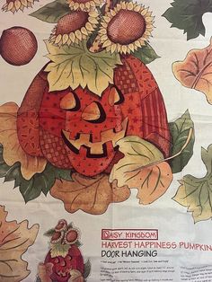 an advertisement for pumpkins is shown on the tablecloth with autumn leaves and sunflowers