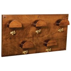 a wooden coat rack with four hooks