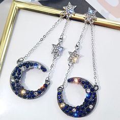 A Beautiful Crescent Moon Is Speckled With Jet Black And Navy Blue Crystals That Resemble Space. Cz Stars Finish The Look. Gift Boxed Hypo-Allergenic Posts Stainless Steel Gold Feather Earrings, Dark Earrings, Galaxy Jewelry, Celestial Crystal, Silver Star Earrings, Mickey Mouse Earrings, Cat Earrings Studs, Crystal Dangle Earrings, Tassel Drop Earrings