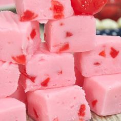 a pile of pink fudges sitting on top of a table