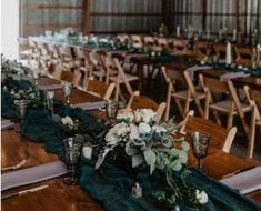 the tables are set with green linens and white flowers