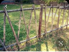 an old wooden fence is in the yard