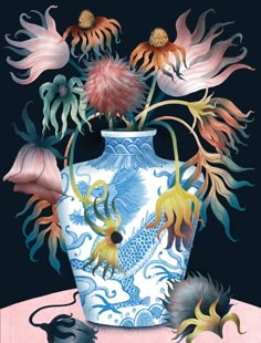 a blue and white vase with flowers in it