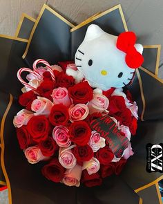 a hello kitty bouquet with roses and candy canes