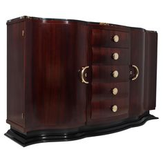 a large wooden cabinet with brass handles and knobs on the doors, side view