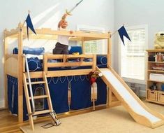 a child's bedroom with a bunk bed and slide