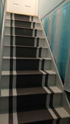 the stairs are painted black and white with a checkerboard pattern