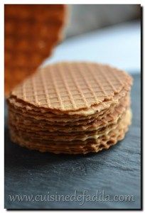 a stack of waffles sitting on top of a black table next to each other