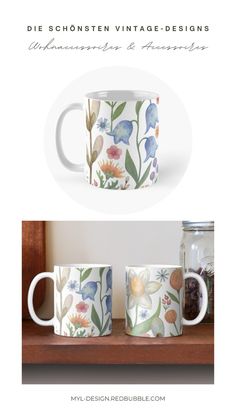 two coffee mugs with flowers painted on them