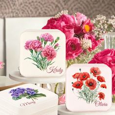 three different types of personalized jewelry cases with flowers in the middle and on top