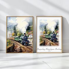 two framed paintings of trains on the tracks