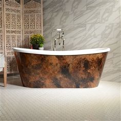 a bath tub sitting on top of a tiled floor