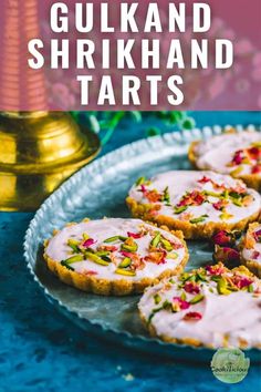 some food is sitting on a plate with the words gukra and shirkhand tarts