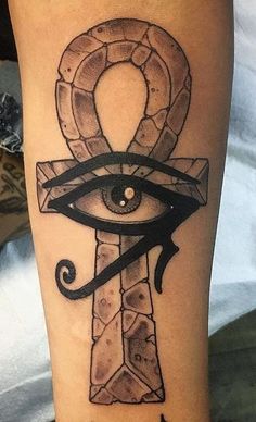 an all seeing eye tattoo on the leg