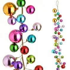 an ornament is hanging on a tree branch with balls attached to the branches