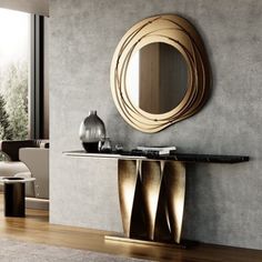 a modern console table with a circular mirror above it