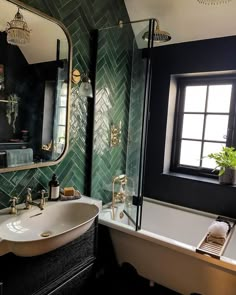 a bath room with a sink a mirror and a bath tub under a bathroom window