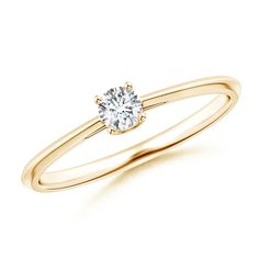 a rose gold ring with a single diamond