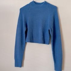 Cropped And Fitted Sweater Tagged A M But Fits More Like A S 62% Acrylic 38% Nylon Knitted Look And Is Super Soft! Nwot!! Never Worn Urban Outfitters Crew Neck Winter Sweater, Urban Outfitters Crew Neck Sweater For Winter, Blue Textured Knit Cropped Sweater With Crew Neck, Blue Cozy Knit Cropped Sweater, Cozy Blue Knit Cropped Sweater, Blue Knitted Cropped Sweater For Winter, Blue Knit Stretch Sweater, Knitted Blue Cropped Sweater For Winter, Blue Stretch Knit Sweater