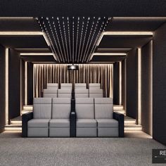 an empty theater with rows of seats and lights on the ceiling is lit by recessed lighting