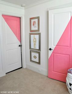 an image of a pink and white door in a room with pictures on the wall