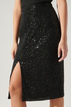 This black sequin skirt is cut with a leg-baring slit that allows you to steal the spotlight with every step. • Elastic Waist• Lined• Side Slit• Sequins Black Sequin Skirt, Sequin Pencil Skirt, Sequin Midi Skirt, Friday Nights, Pencil Skirt Black, Black Midi Skirt, Dancing Queen, Tailored Jacket, Black Sequins