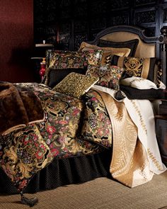 the bed is covered with many different types of comforters