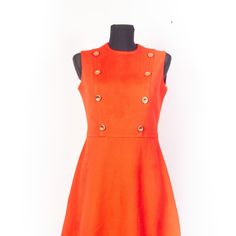 Superb Twiggy style red orange sleeveless 60s 70s mod scooter mini dress.  Has decorative gold metallic buttons on the front .  There is zipper on the back.  The dress is lined with red  rayon lining.  The producer is Cornet, the dress is made in West Germany. The fabric not tagged, but it is semi sheer, a bit crimped jersey polyester CONDITION The dress is in  good condition, there aren't holes, stains, scratches or other damages. SIZE old size tagged as EU36/38,lookls like could fit best for Small size and smallest end of Medium size ,  but please read the measurements carefully! Our small size dummy Ida with Bust:87 cm / 34", Waist: 65 cm / 25.5" Hips: 91 cm / 35.5", the dress fitted well, was free space left MEASUREMENTS  Fabric is a bit bit stretchable, measurements are taken without 1960s Twiggy, Twiggy Style, Twiggy Fashion, Twiggy Dress, Mod Scooter, 70s Mod, 60s Dress, Mod Fashion, Short Mini Dress