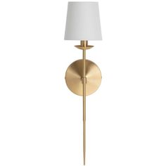 a gold wall light with a white shade