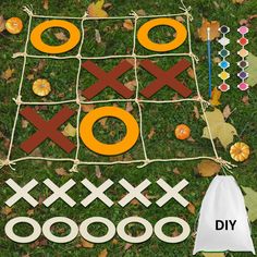 an image of a tic - tac - toe game in the grass with pumpkins