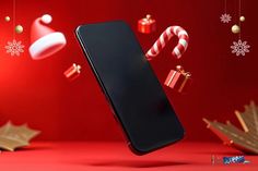 an image of a cell phone in the air with candy canes and christmas decorations around it