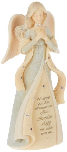 an angel figurine holding a heart in its hands