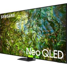 the samsung tv is shown with an image of green and blue art work on it