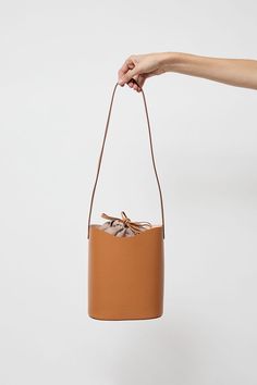 Vegetable-tanned cowhide leather bucket bag with cross body strap. Structured flat bottom. A perfect everyday bag that will wear beautifully over time. Black Crane, Leather Bucket Bag, Leather Bucket, Everyday Bag, Cowhide Leather, Cross Body, Bucket Bag, Leather