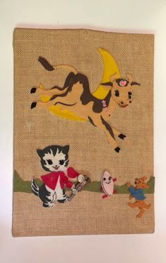 an image of a painting with animals and cats on burlocked paper in the background