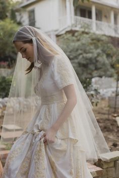 a woman in a wedding dress and veil