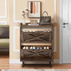 a wooden shoe rack sitting on top of a hard wood floor next to a door