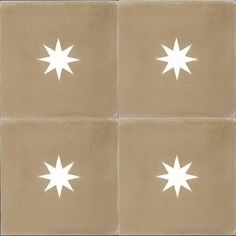 four square tiles with white stars in the middle and one on each side, all facing different directions