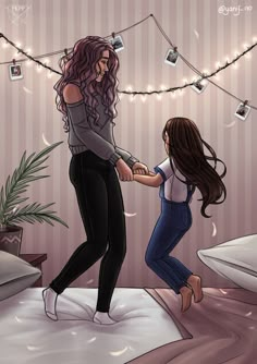 two women are holding hands while standing on a bed with string lights strung above them