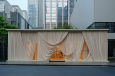 the entrance to a building with drapes covering it