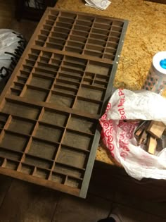 a table that has some kind of tray on it with plastic bags next to it