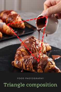 someone pouring chocolate onto some croissants on a black plate with the words, food photography triangle composition